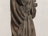 a statue of a woman holding a baby on a table