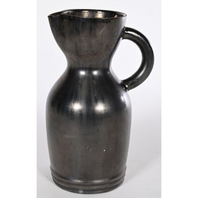 a black vase with a handle on a white background