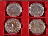 six coin set in a red box with red velvet lining