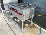an image of a kitchen with a stove and two pots on it
