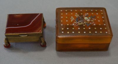 a small wooden box and a small box on a table