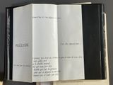 an open book that has a black and white cover