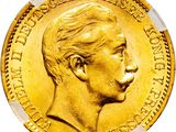 gros plan d'une pièce d'or sur fond blanc