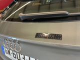 a close up of a car with a sticker on the back of it