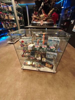 a glass display case with a lot of items inside of it