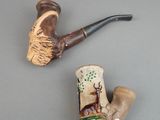 a picture of a pipe and a figurine on a table