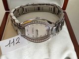 a watch in a box with a price tag on it