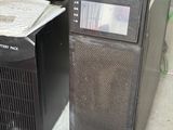 two computers sitting next to each other in a room