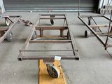 many pieces of metal sitting on wheels in a warehouse