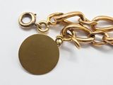 an image of a gold chain with a coin attached to it