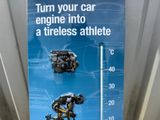 a sign that says turn your car engine into a tireless athlete