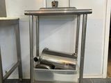 a metal table that has a roll of foil on it