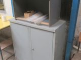 a cabinet that has a bunch of boxes on top of it
