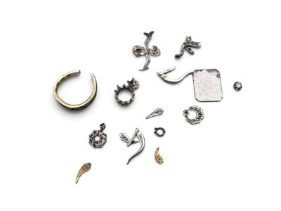 many different types of ear piercings on a white surface