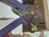 a close up of a wrenet that is attached to a piece of wood