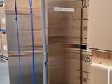 a refrigerator that is sitting in the middle of a warehouse