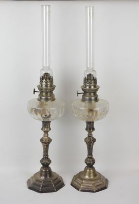 pair of antique brass candlesticks with clear glass shades