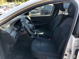 the interior of a car with the door open and the driver ' s seat down