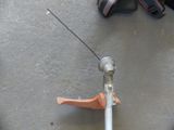 a close up of a pole with a pair of headphones on top of it