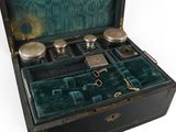 a black box with silverware in it and a pair of scissors