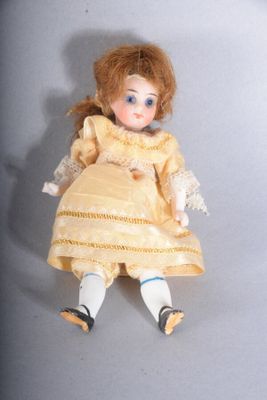 a small doll that is sitting on a table
