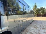 an image of a bus parked in a parking lot
