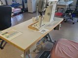 a sewing machine sitting on a table in a room