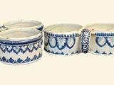 three blue and white mugs sitting next to each other