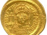 une pièce d'or à l'effigie d'une femme