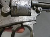 a close up of a gun in a person ' s hand