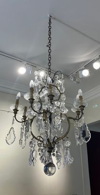 a chandelier hanging from the ceiling in a living room