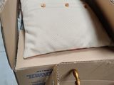 a suitcase and a bag in a box on the floor