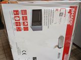 a box that is sitting on the floor next to a microwave