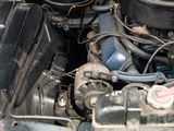 a close up view of a car engine with its hood open