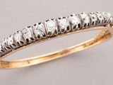 a close up of a diamond ring on a table