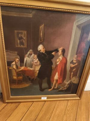 tableau représentant un homme en costume noir et une femme en robe rouge