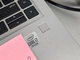 a pink sticker on the keyboard of a laptop computer