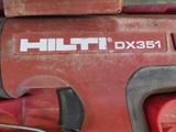 a close up of a red tool with the words hitt dx351 on it