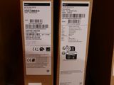 two boxes of acer products sit on a shelf in a store