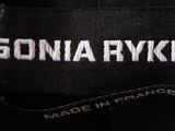 the label of a black jacket with a white logo on it