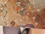 a close up of a piece of wood with paint on it