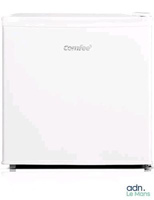 the small white refrigerator is open and ready to be used
