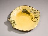 a small bowl with a drawing of a fish on it