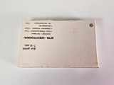a business card sitting on top of a white table
