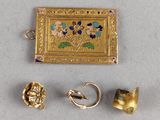 three pieces of gold and enamel jewelry including a ring, earring, and broochle