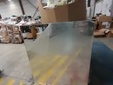 a large piece of glass sitting on a pallet in a warehouse