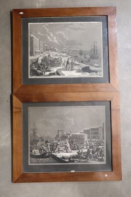 two pictures hanging on the wall of a room