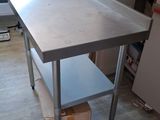 a kitchen table that is sitting in the middle of a room