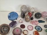 many different types of rocks and stones on the table