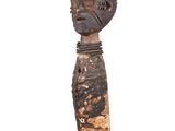 an image of a wooden sculpture of a man ' s head on a black base